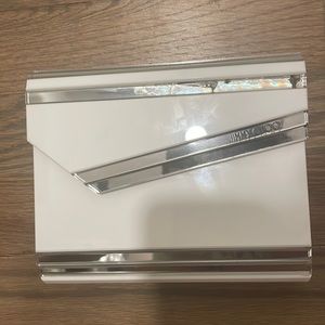 Jimmy choo candy clutch with chain. It has a minor damage as shown in pics.